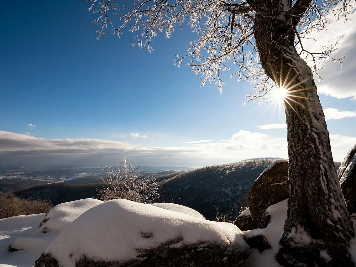 Snow-covered mountain overlook at sunrise for a Massanutten ski weekend